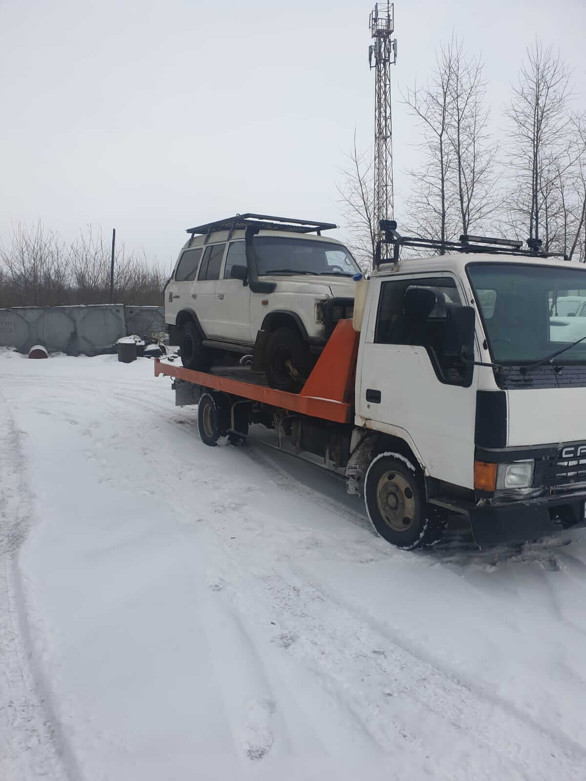 Фото вытаскиавания авто из кювета манипулятором